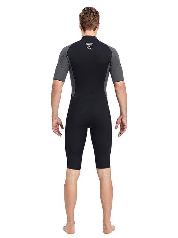 Back view of a male wearing a black one-piece short sleeve wetsuit for water sports. SF0833 wetsuit offers comfort and UV protection.
